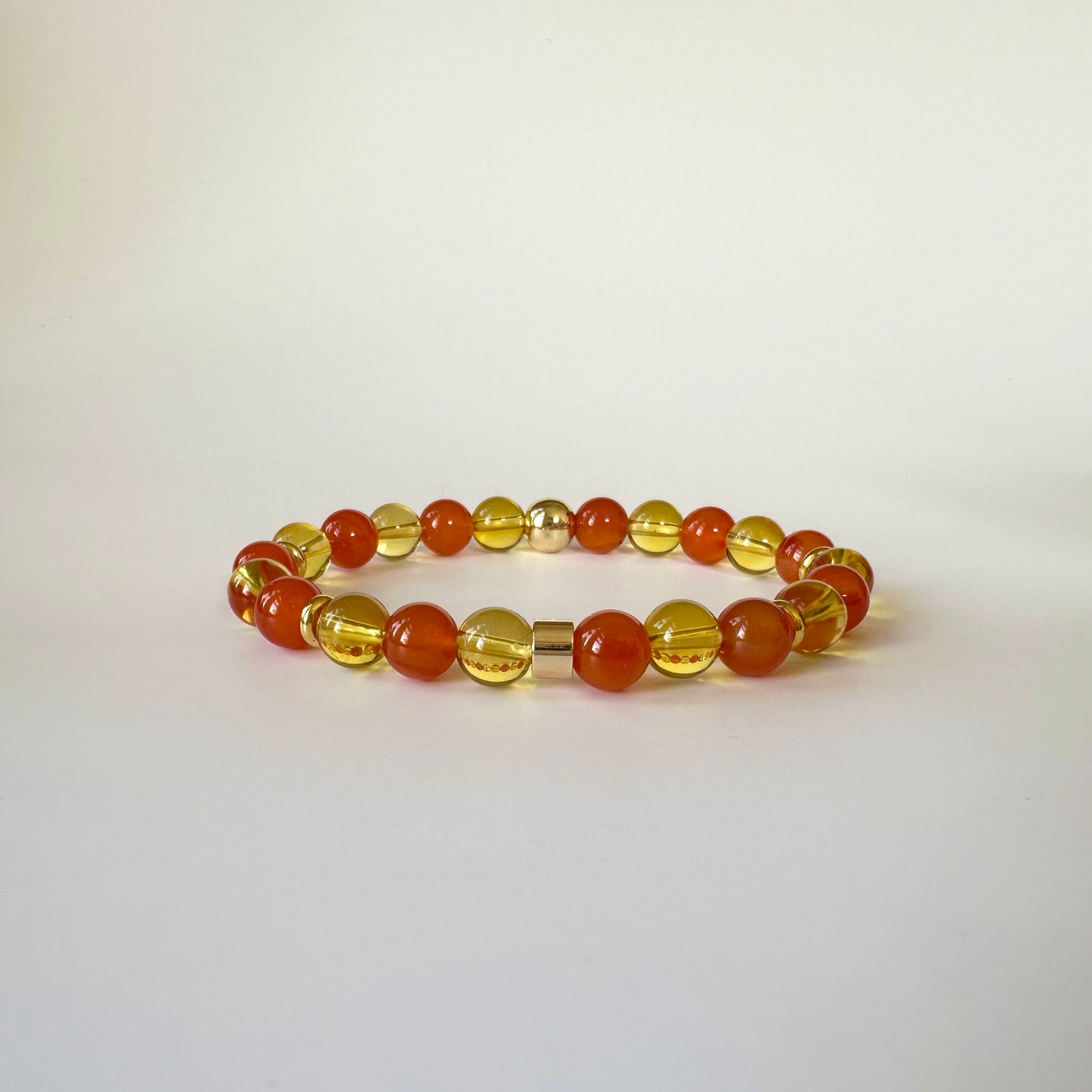 Apollo's Prosperity Bracelet with Citrine and Red Carnelian stones, symbolizing abundance, motivation, and positivity in a stylish design.