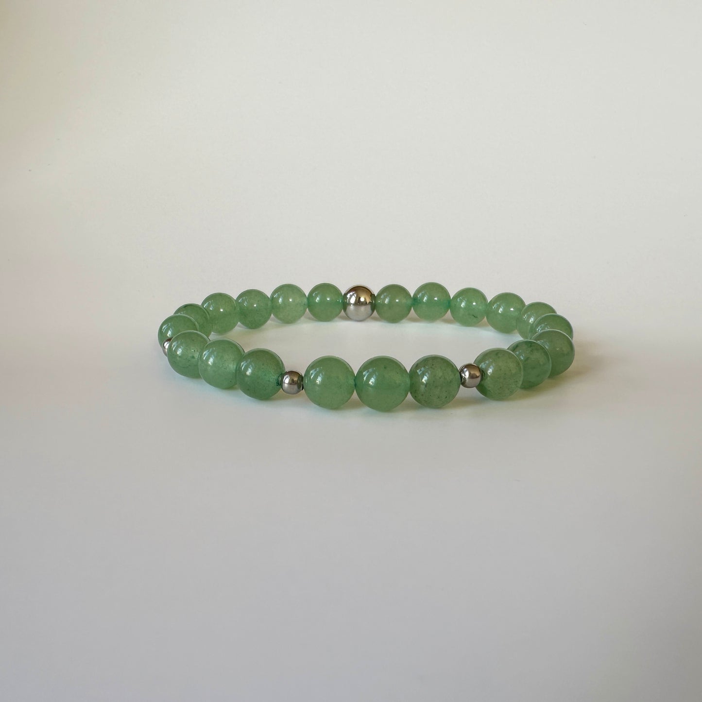 Close-up of Natural Green Aventurine Bracelets for couples, showcasing their soothing green tones and elegant design.