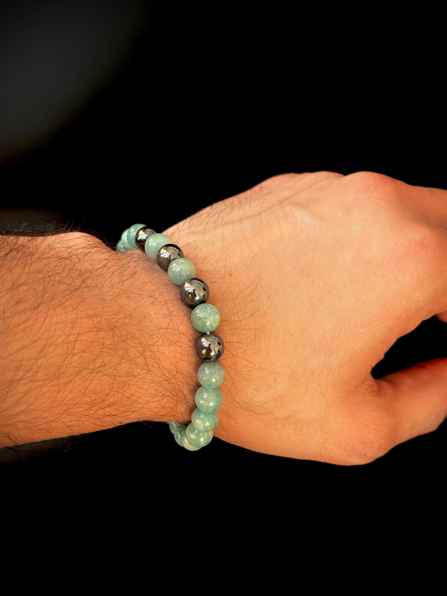 Model wearing the Natural Amazonite Bracelet for Him, highlighting its vibrant colors and empowering qualities.