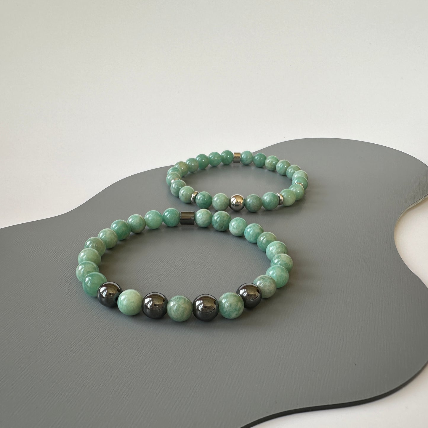 Natural Amazonite Bracelets for couples, symbolizing truth and harmony, displayed elegantly on a neutral background.