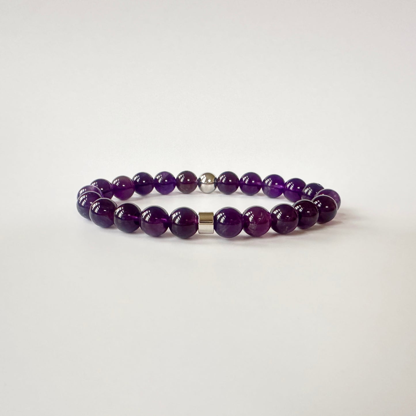 Elegant Natural Amethyst Bracelet with deep purple gemstones, representing tranquility, balance, and spiritual growth.
