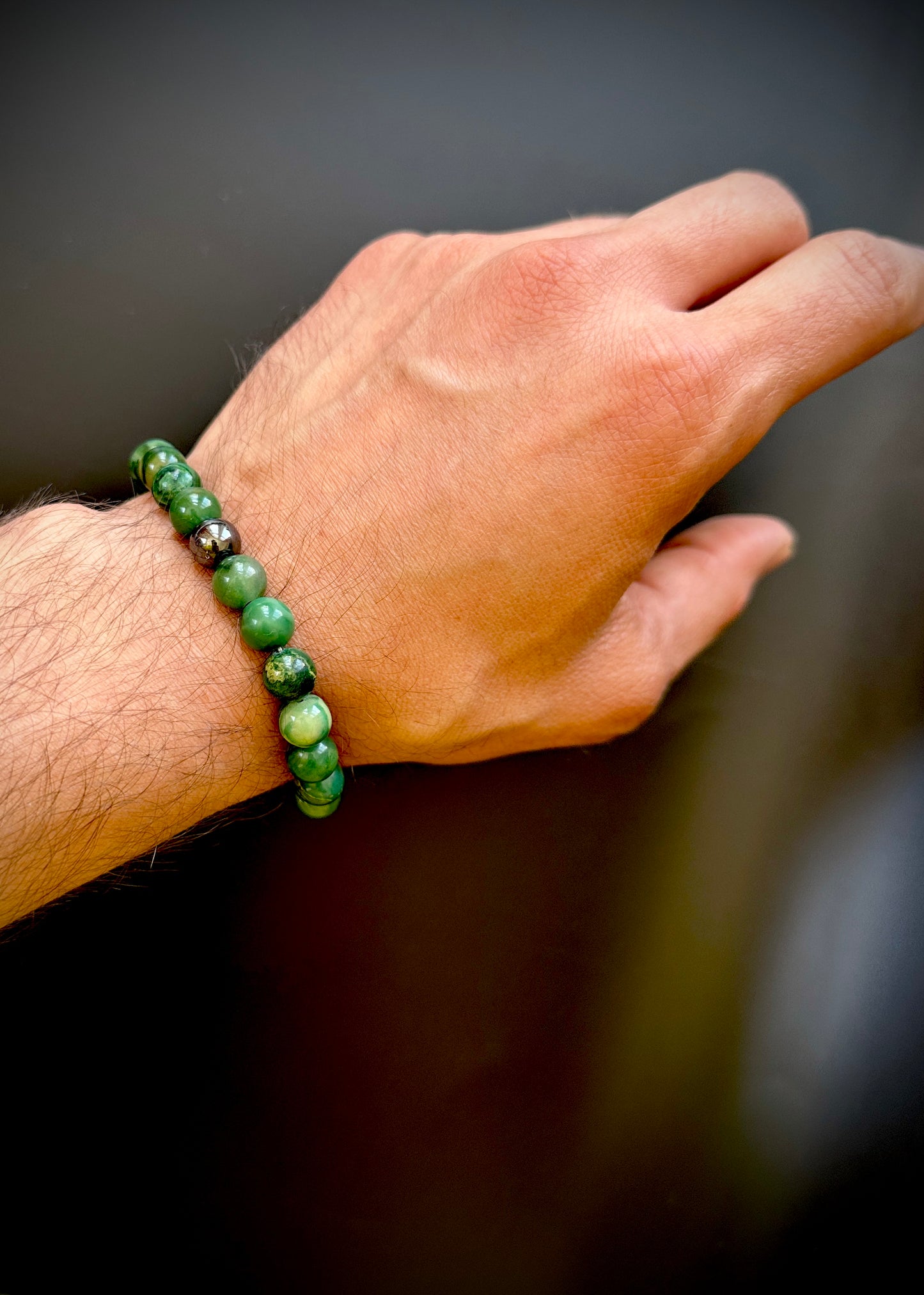 Model wearing the Natural Jade Bracelet for Him, emphasizing its protective and harmonious qualities.