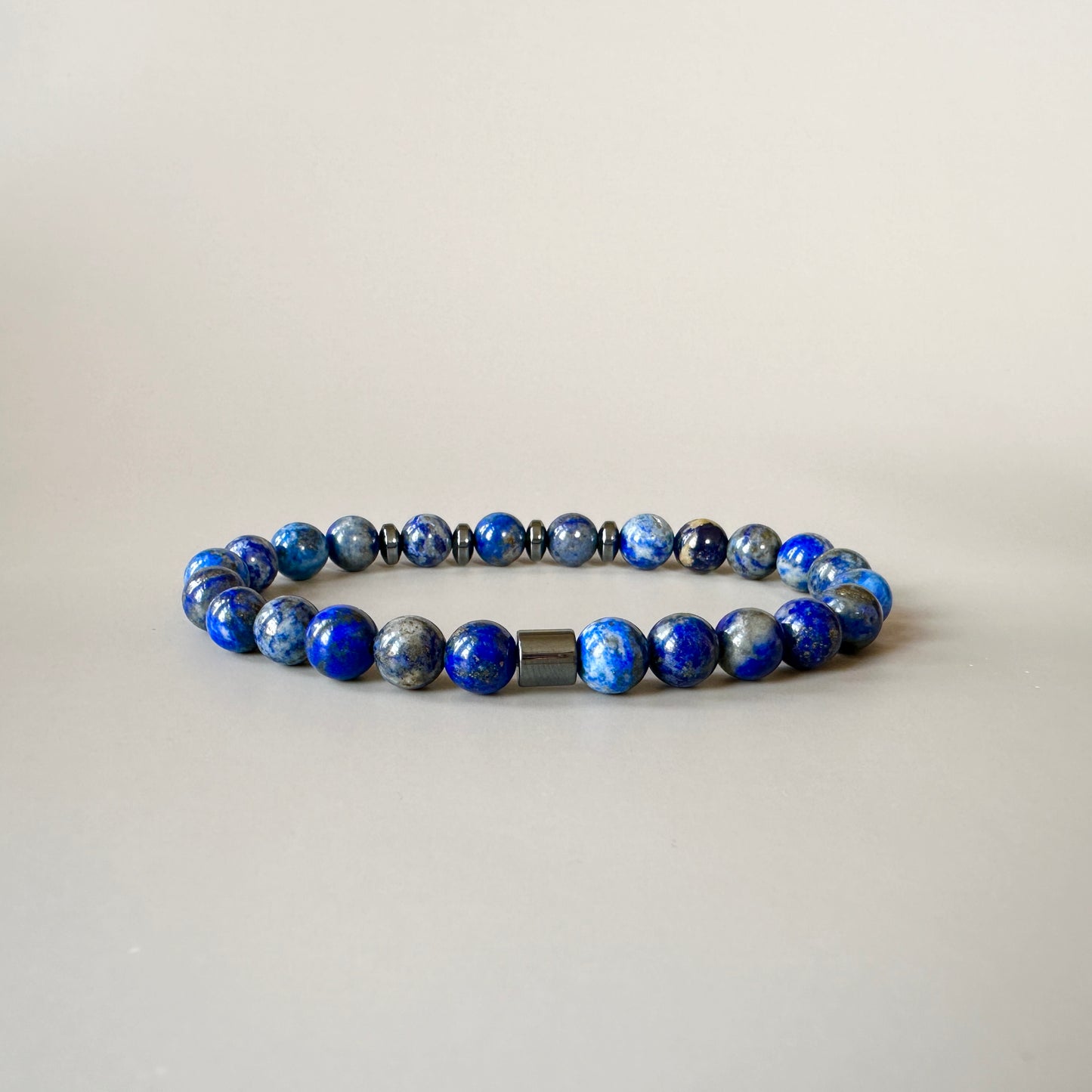 Front view of the Natural Lapis Lazuli Bracelet for Him, featuring rich blue lapis lazuli stones with golden specks.