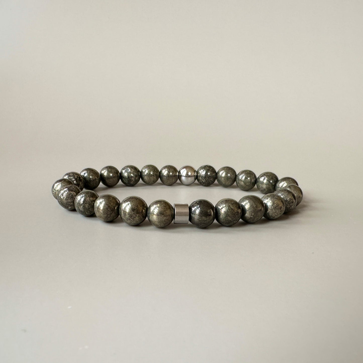 Close-up of lustrous pyrite beads on the Natural Pyrite Bracelet, showcasing their natural metallic shine.