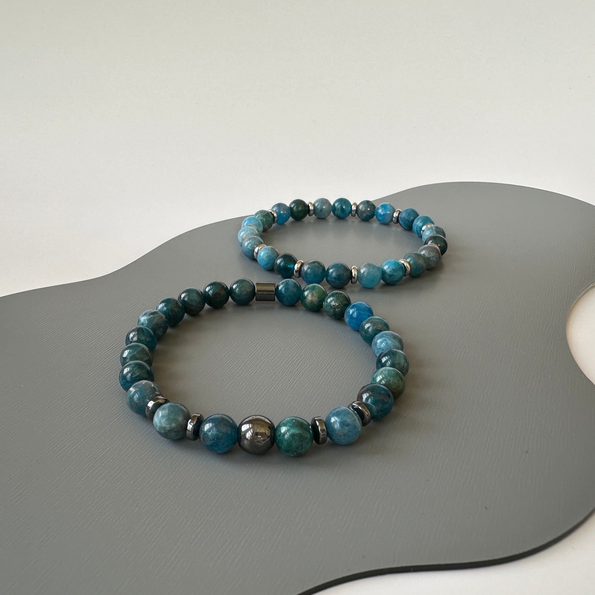 Close-up of polished apatite beads on the Natural Apatite Bracelets for Couples, highlighting their striking blue color.