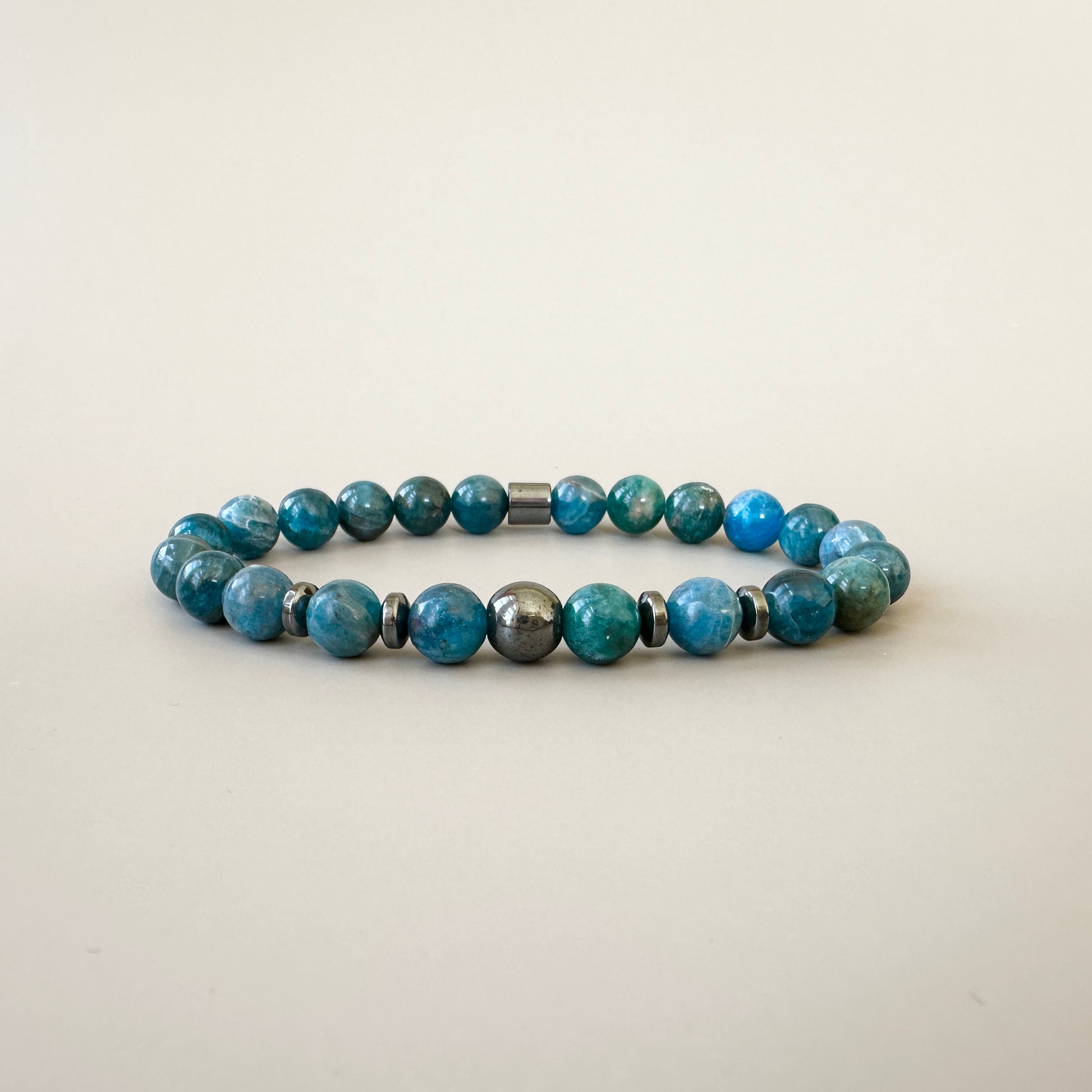 Natural Apatite Bracelets for Couples displayed, emphasizing the brilliant blue color and smooth texture of the apatite stones.