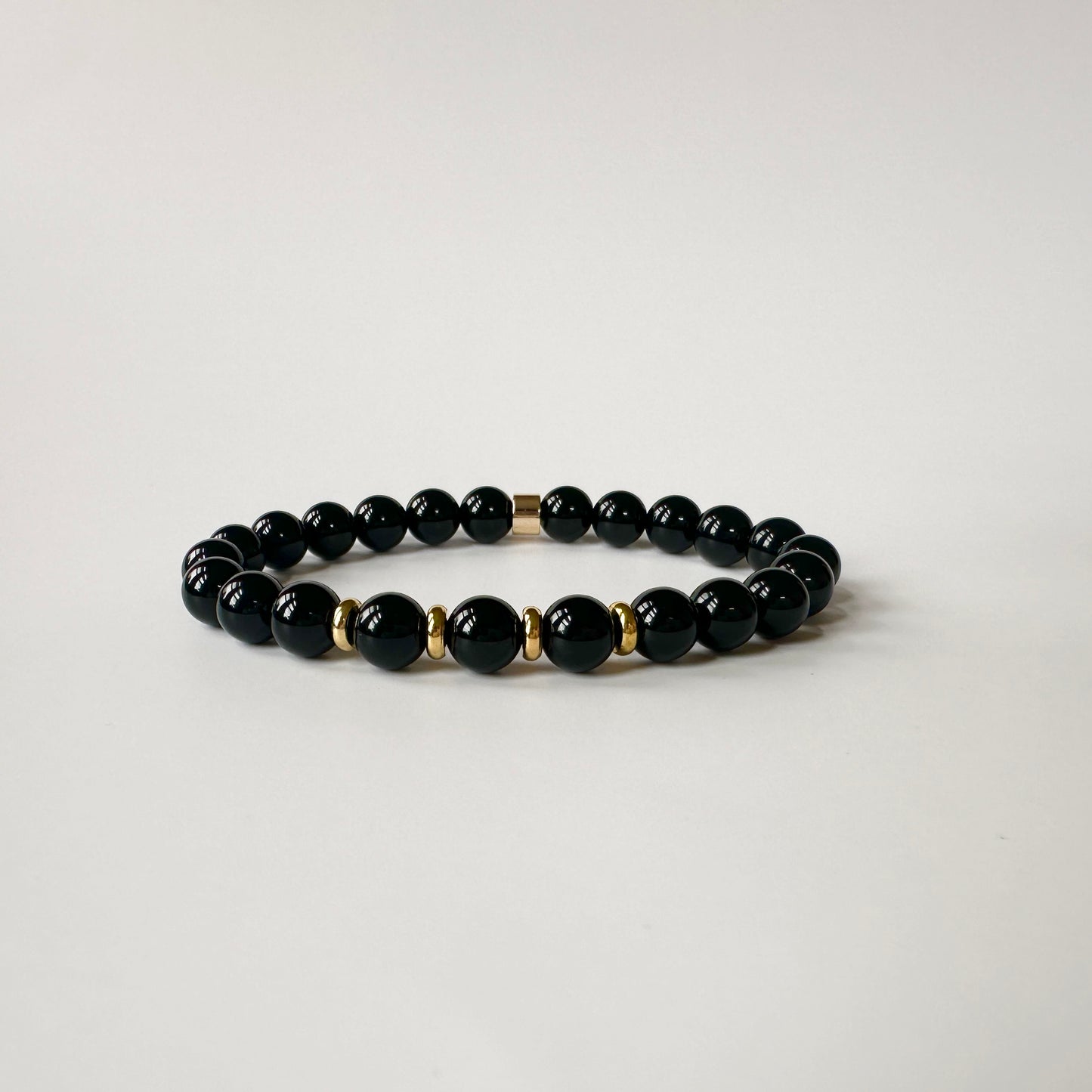 Close-up of polished black onyx beads on the Natural Black Onyx Bracelets for Couples, highlighting their glossy finish.