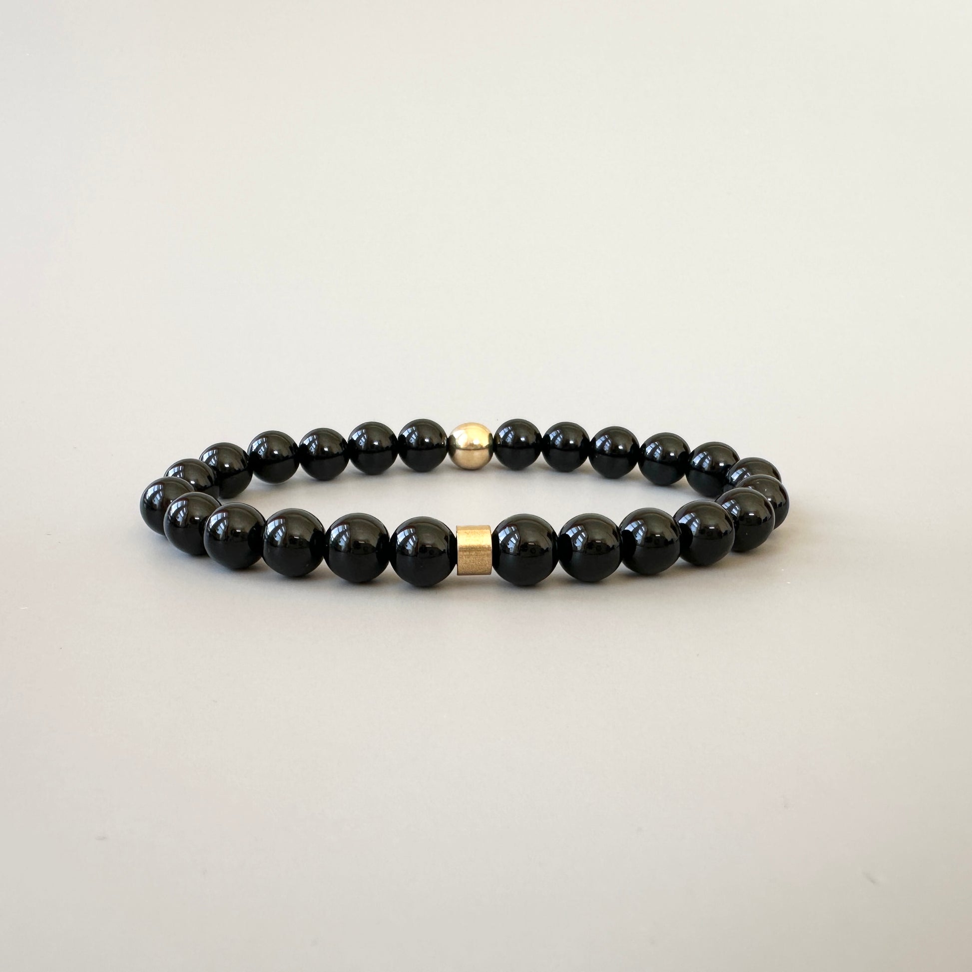 Natural Black Onyx Bracelets for Couples displayed, emphasizing the deep black color and sophisticated design.