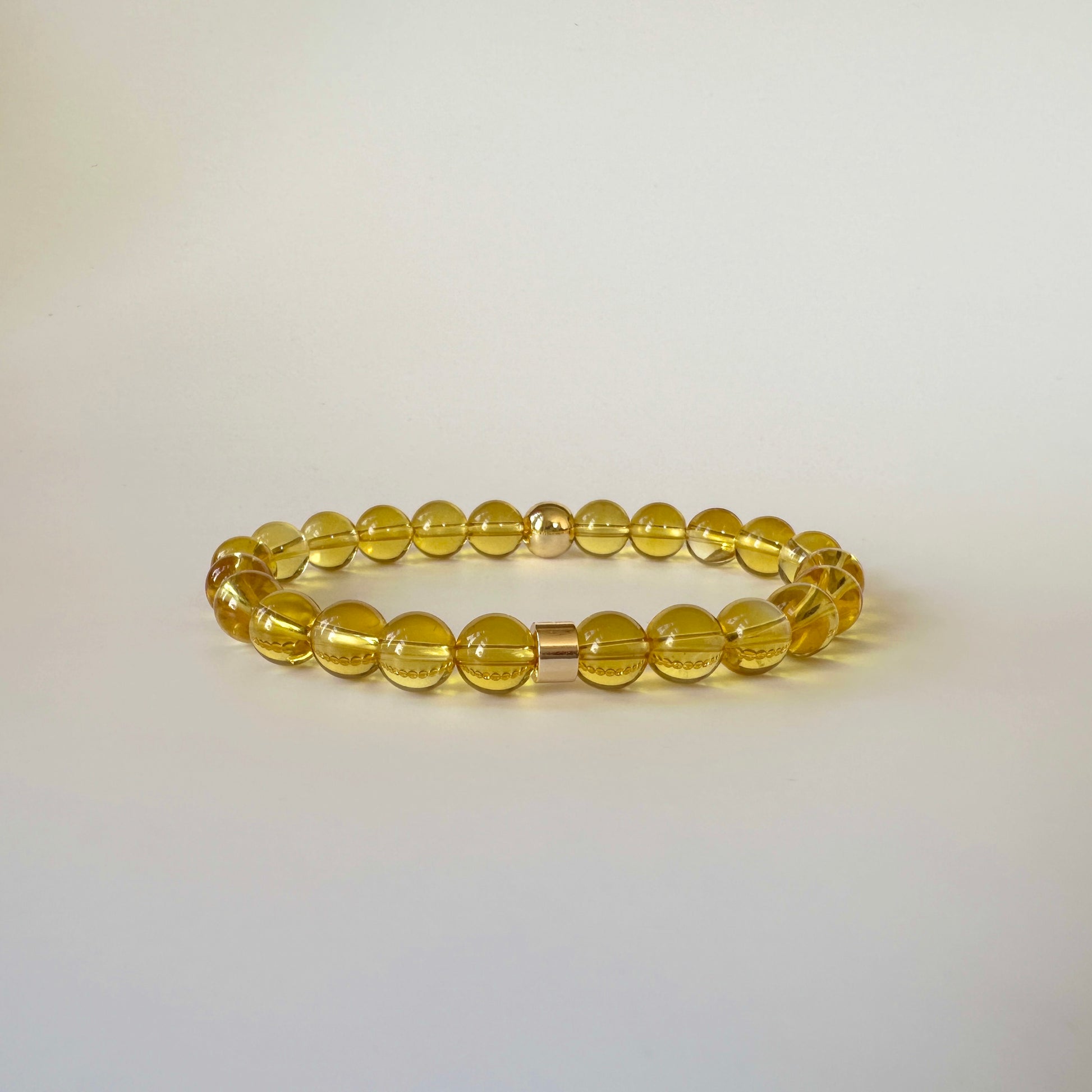 Close-up of Natural Citrine Bracelets for couples, showcasing their vibrant yellow hues and timeless design.