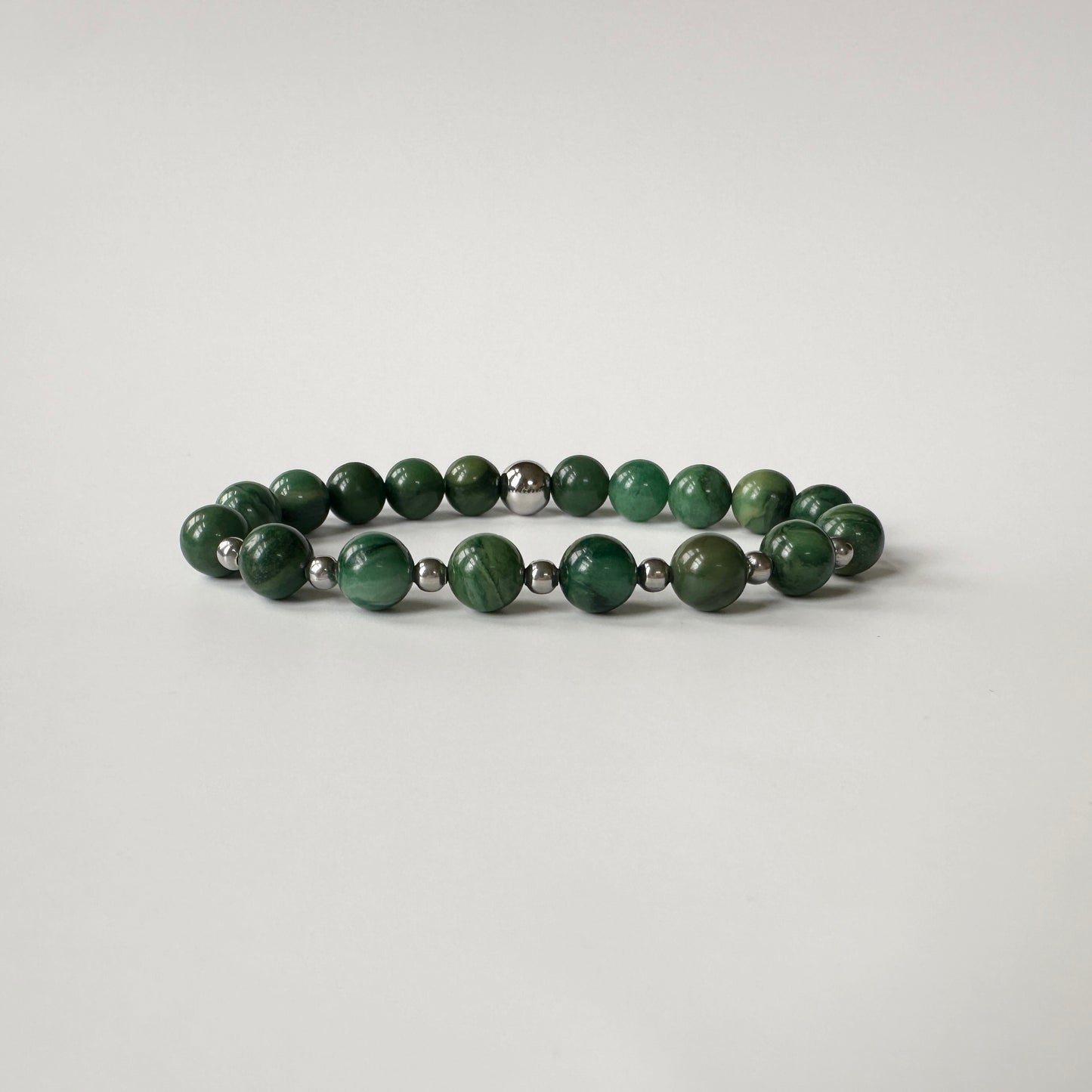 Elegance Natural Jade Bracelet with green jade gemstones, symbolizing protection, harmony, and positive energy.