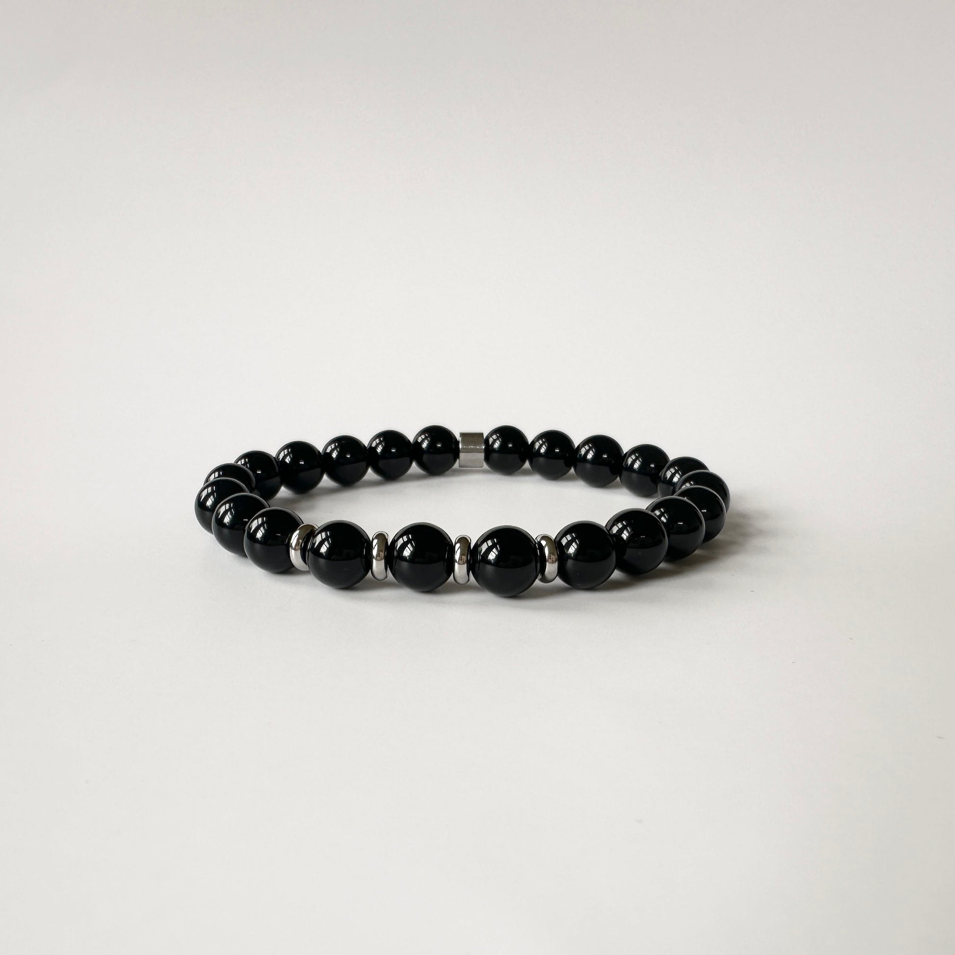 Elegant Natural Black Onyx Bracelet, symbolizing transformation and protection with its striking black tones and powerful energy.