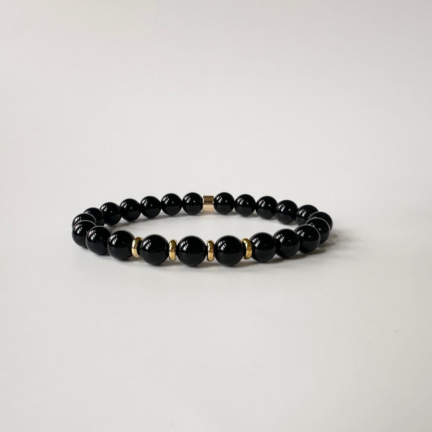 Elegant Natural Black Onyx Bracelet, symbolizing transformation and protection with its striking black tones and powerful energy.