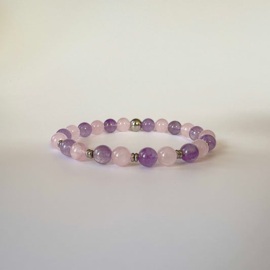 Elysian Heart Bracelet featuring mixed rose quartz stones, symbolizing love, harmony, and emotional healing.