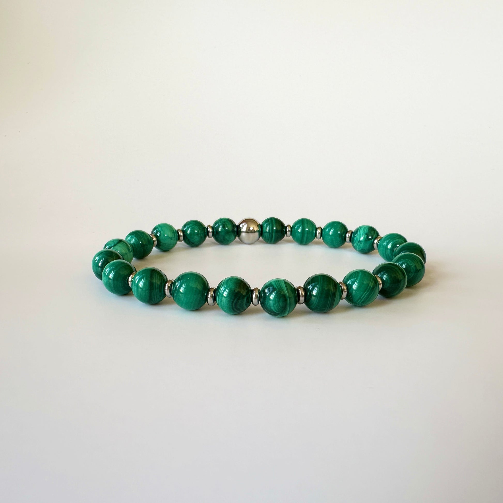 Exquisite Natural Malachite Bracelet showcasing vibrant green bands, symbolizing transformation, protection, and courage.