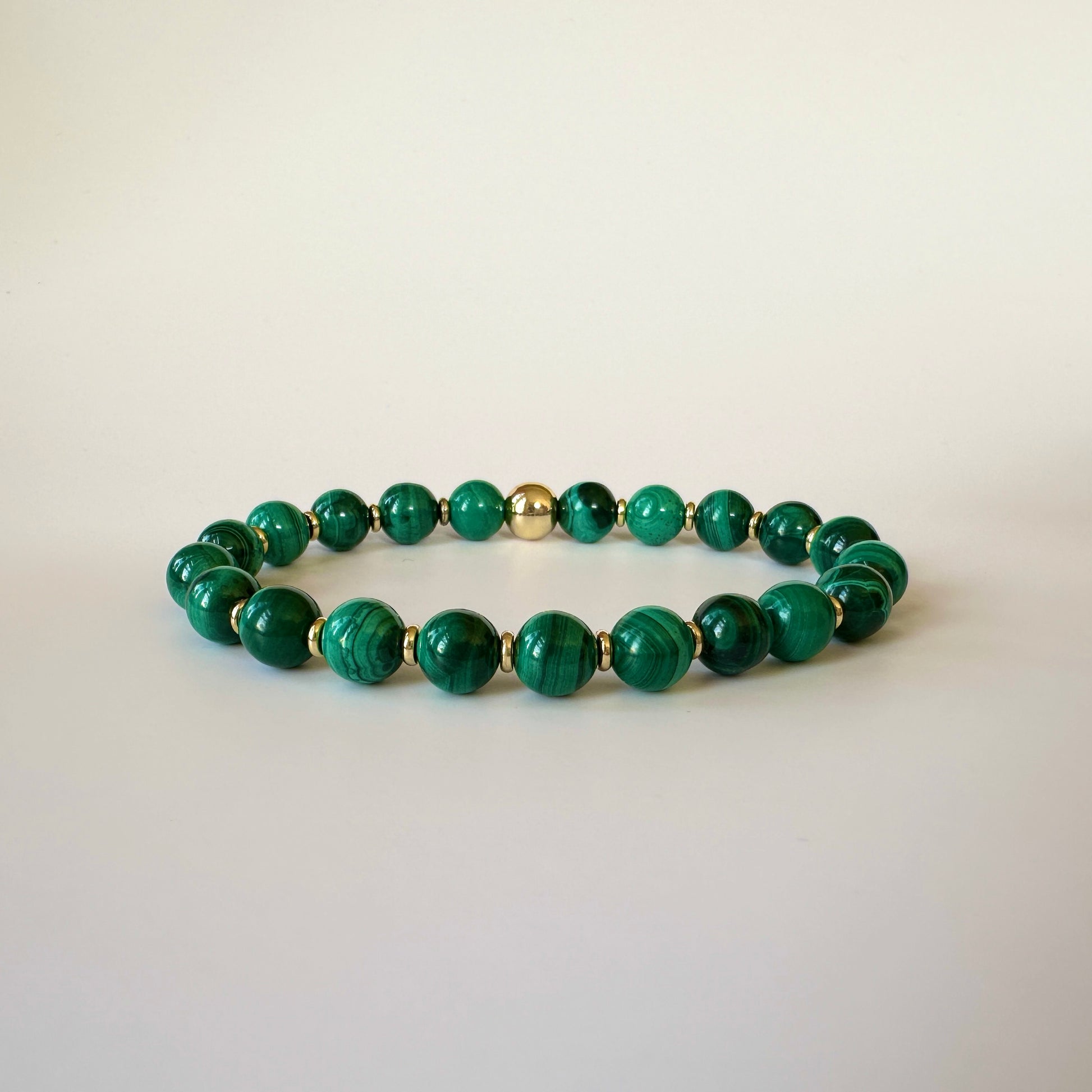 Exquisite Natural Malachite Bracelet showcasing vibrant green bands, symbolizing transformation, protection, and courage.