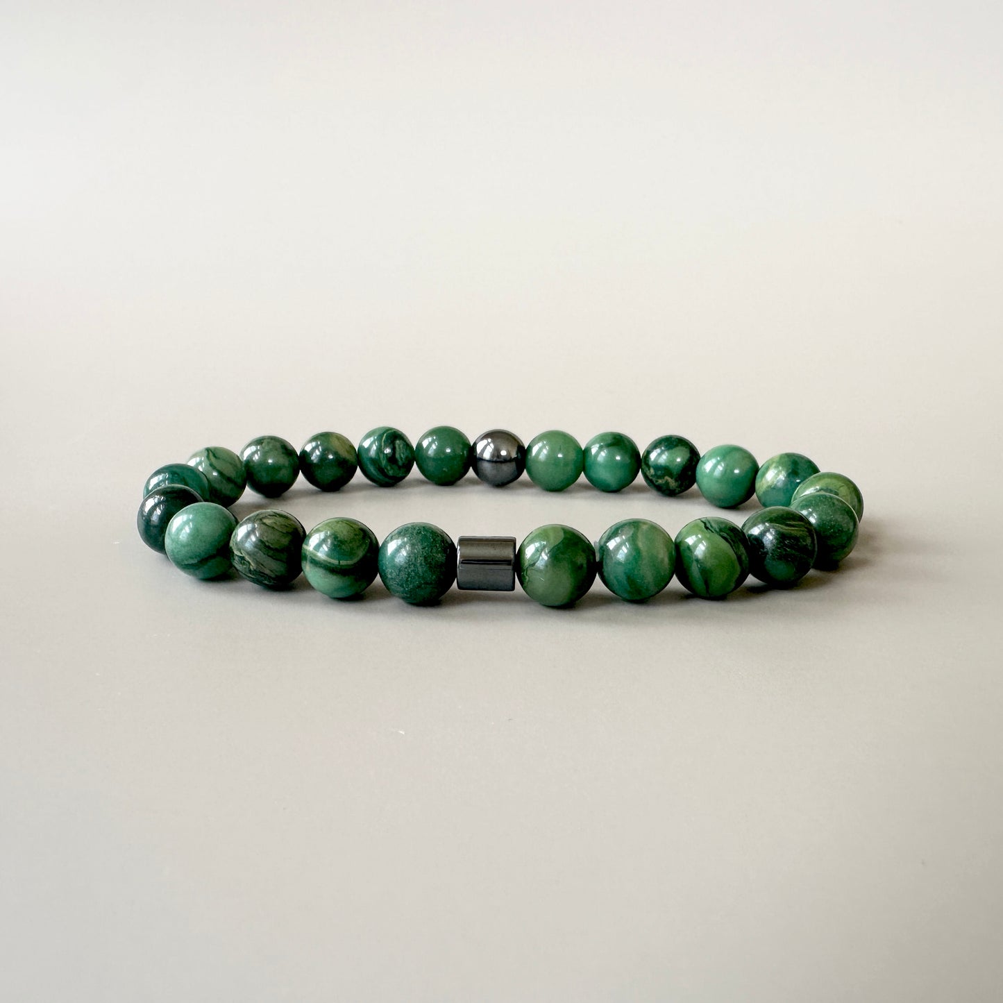 Natural Jade Bracelets for Couples displayed, emphasizing the serene green color and elegant craftsmanship.