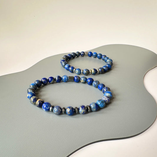 close-up of polished Lapis Lazuli beads, highlighting the deep blue color and smooth texture.