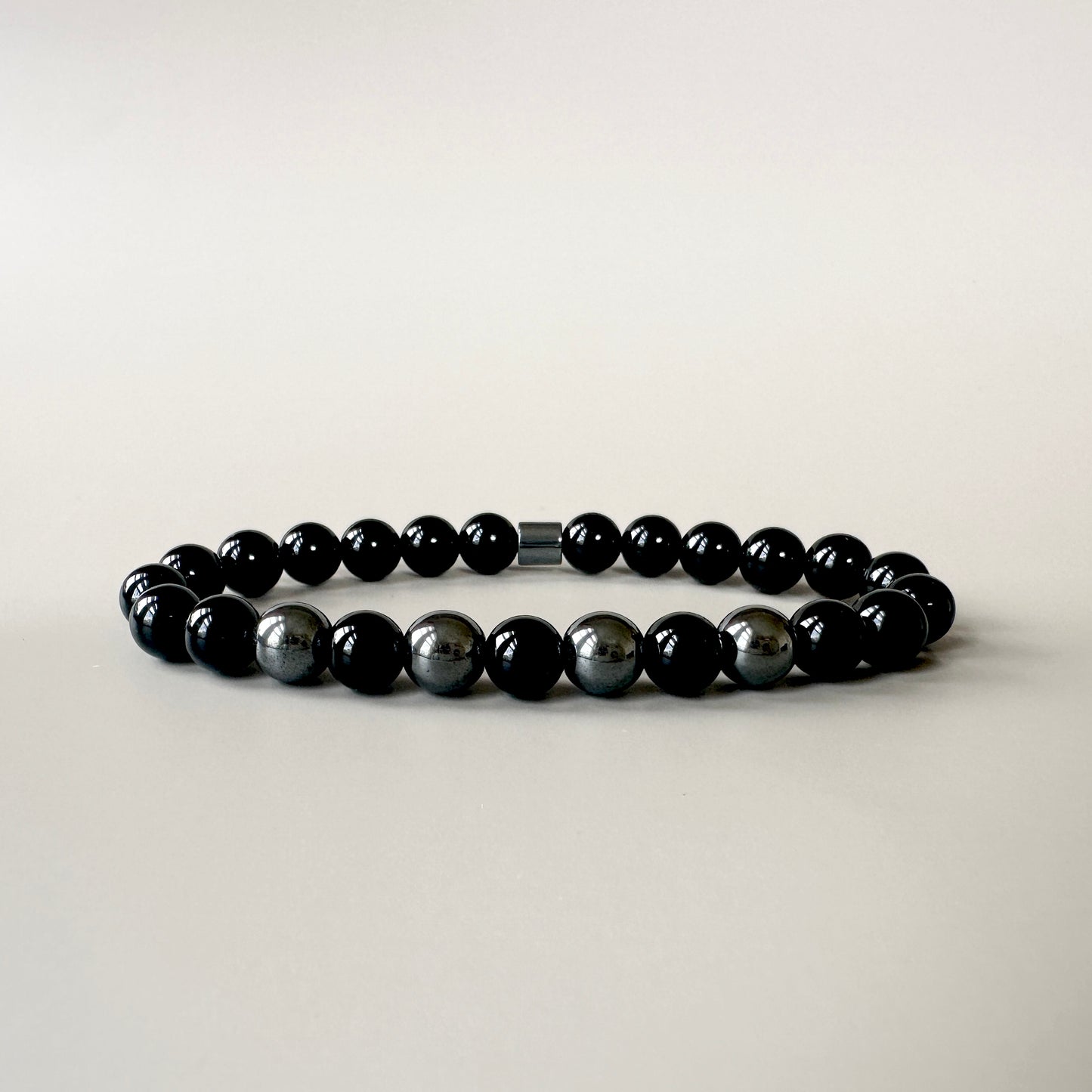 Front view of the Natural Black Onyx Bracelet for Him, featuring polished black onyx stones with a sleek, elegant design.