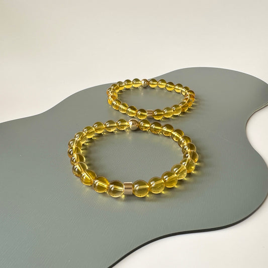 Natural Citrine Bracelets for couples, symbolizing abundance and joy, displayed elegantly on a neutral background.