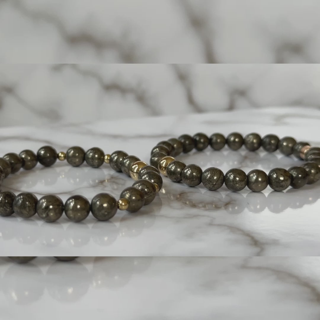 Natural Pyrite Bracelets for Couples displayed, emphasizing the luminous golden pyrite stones and their bold, protective energy.