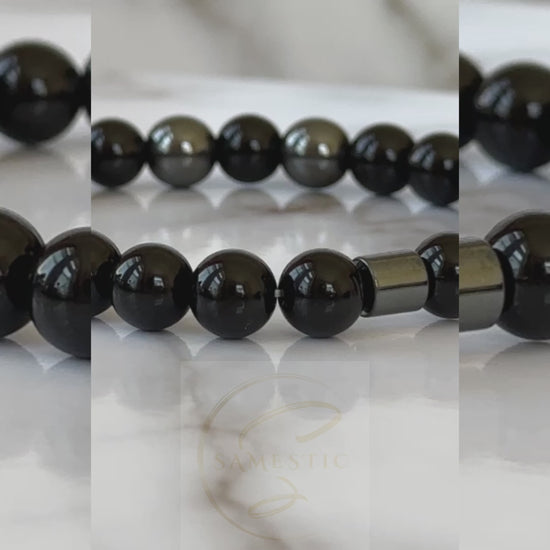 Natural Black Onyx Bracelet displayed with its sleek black stones, symbolizing transformation and protection.