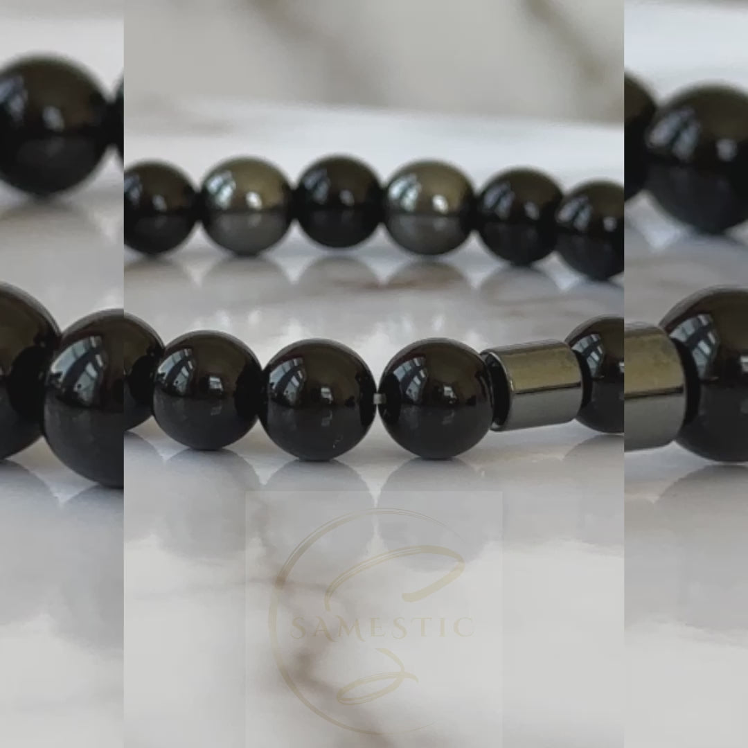 Natural Black Onyx Bracelet displayed with its sleek black stones, symbolizing transformation and protection.