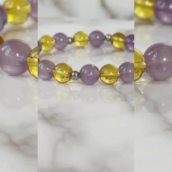 Aurora’s Radiance Bracelet with lavender amethyst and citrine gemstones, promoting tranquility, spiritual growth, positivity, and abundance.