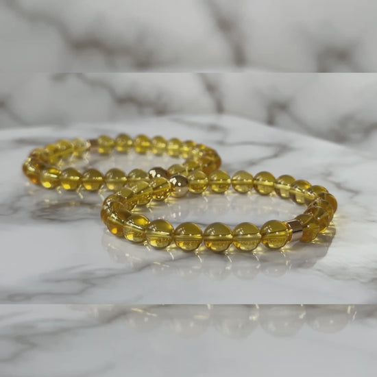 Natural Citrine Bracelets for couples, symbolizing abundance and joy, displayed elegantly on a neutral background.