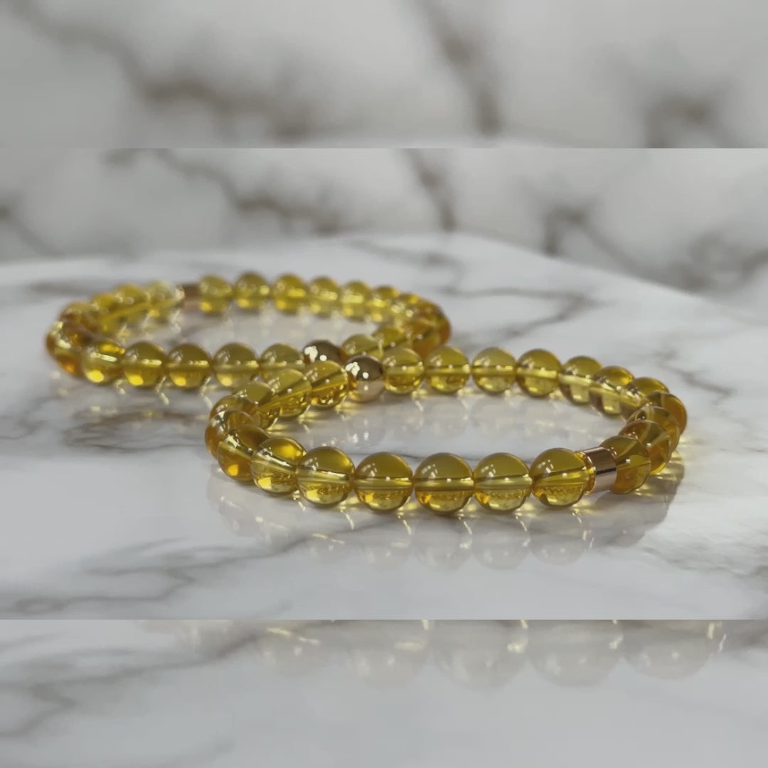 Natural Citrine Bracelets for couples, symbolizing abundance and joy, displayed elegantly on a neutral background.