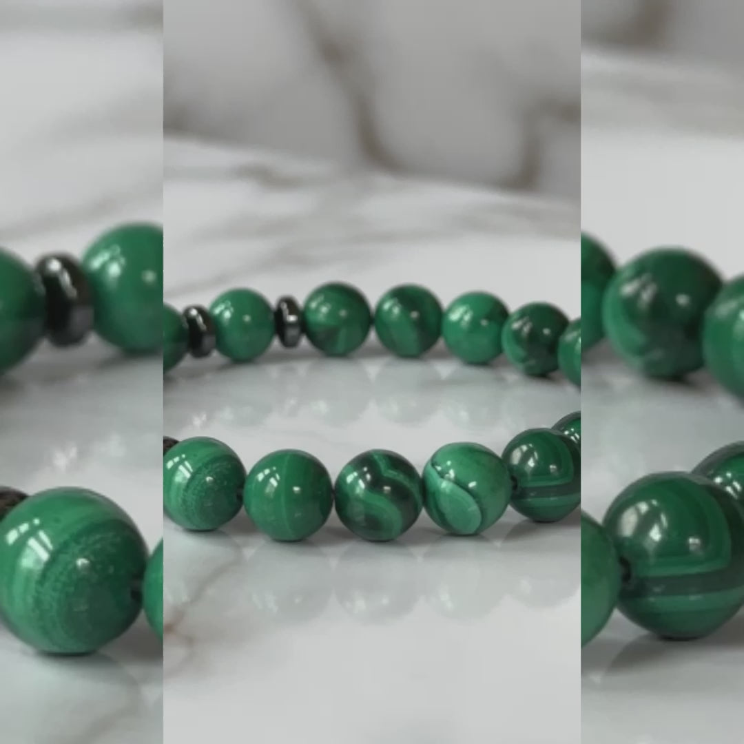 tural Malachite Bracelet displayed with its signature green stones and elegant design.