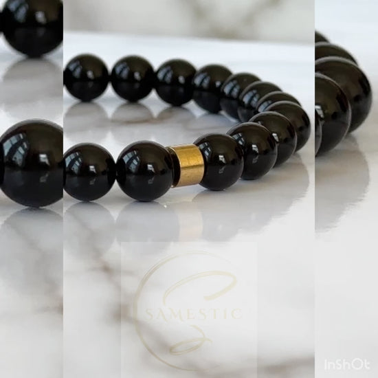 Natural Black Onyx Bracelet displayed with its sleek black stones, symbolizing transformation and protection.