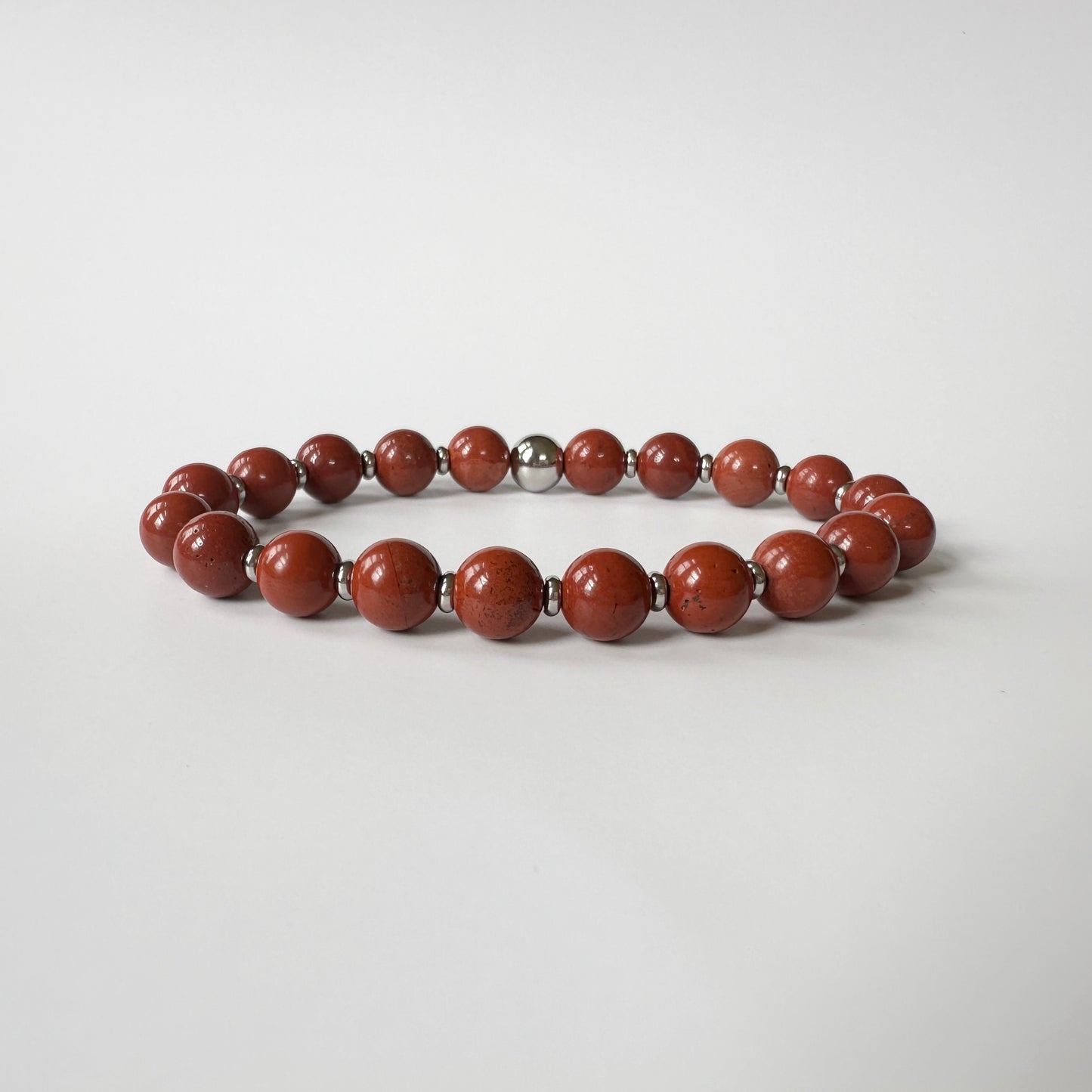 Radiant Natural Red Jasper Bracelet featuring earthy red tones, symbolizing grounding, emotional balance, and energy empowerment.